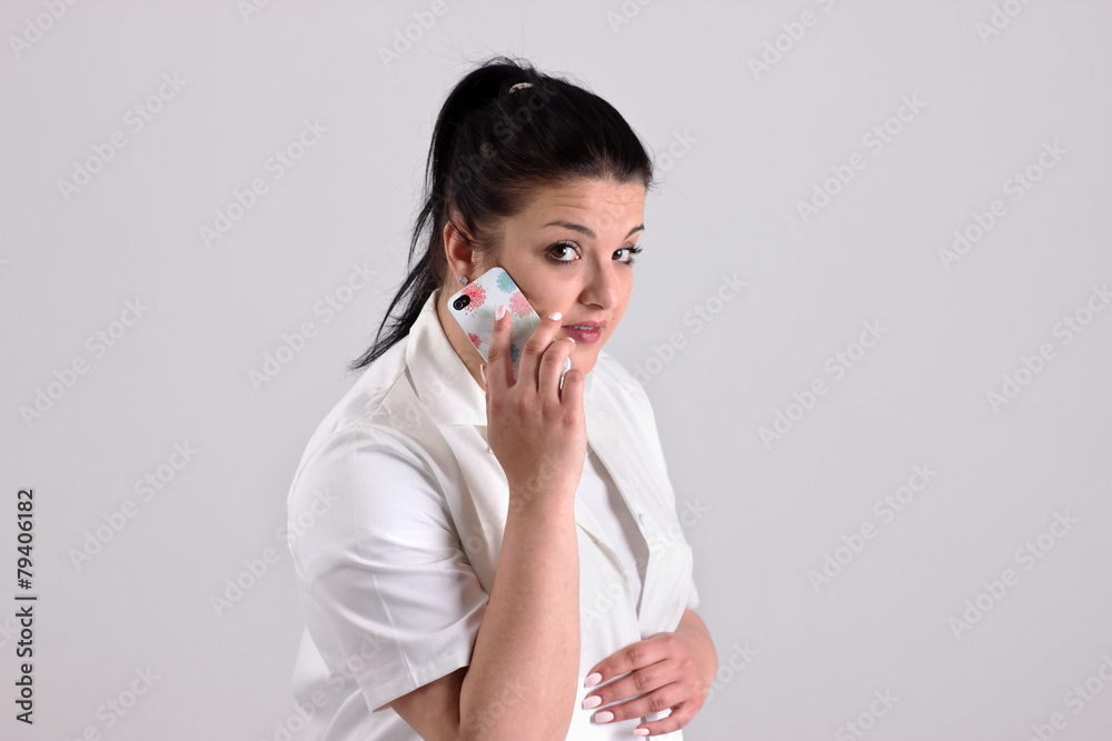 Lady Doctor in Clinical Clothes is Calling to Patient Lady Doctor in Clinical Clothes is Calling to Patient