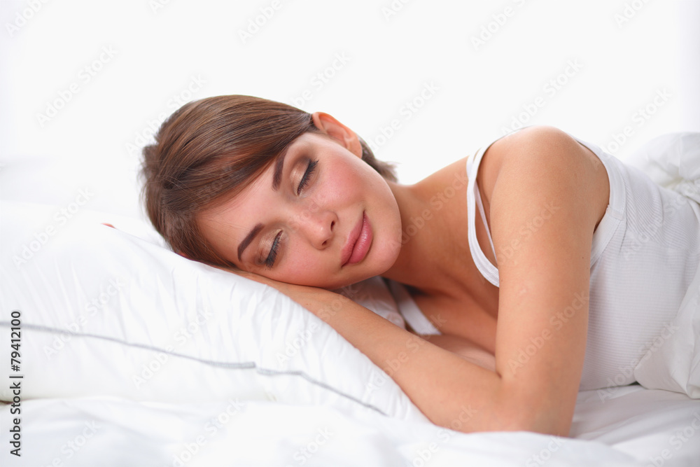 Beautiful girl sleeps in the bedroom, lying on bed Beautiful girl sleeps in the bedroom, lying on bed
