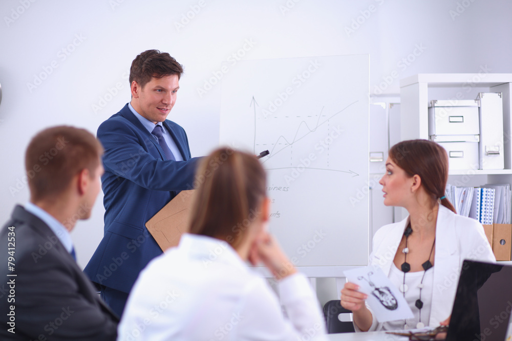 Business people sitting and discussing at business meeting, in Business people sitting and discussing at business meeting, in