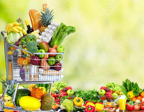 Shopping cart with vegetables and fruits.