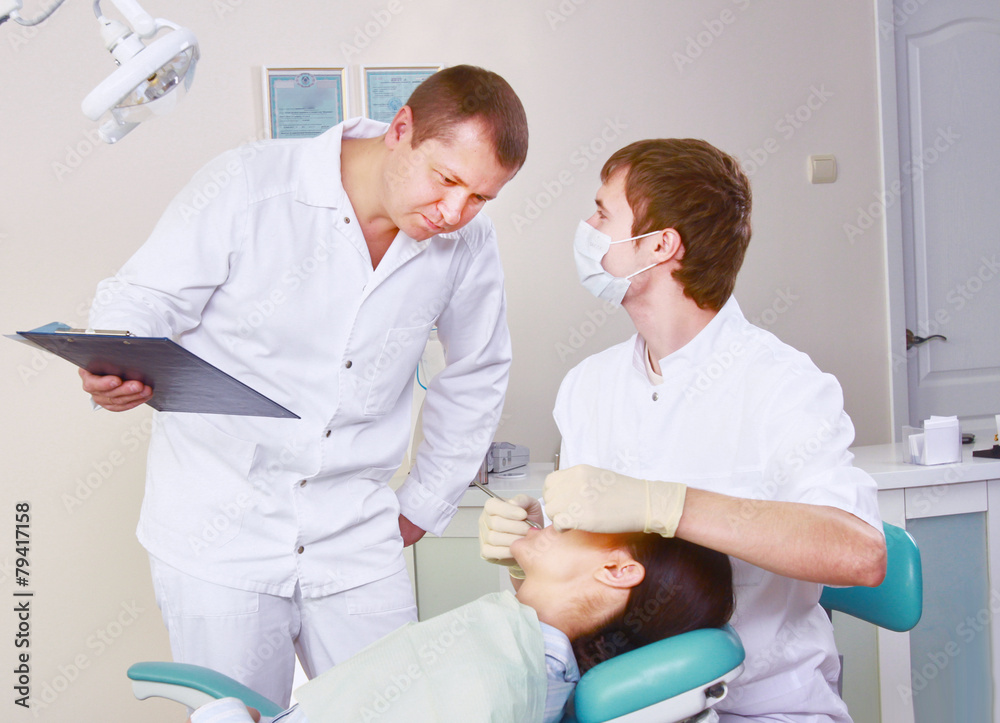 Young woman with dentist in a dental surgery. Healthcare Young woman with dentist in a dental surgery. Healthcare