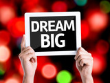 Tablet pc with text Dream Big with bokeh background