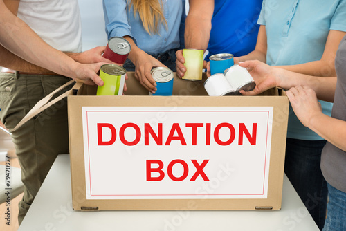 People With Donation Box Holding Cans