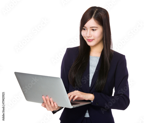 Young businesswoman use of laptop © leungchopan
