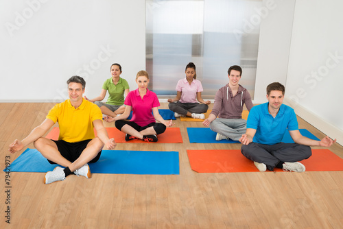 Group Of People In Lotus Position