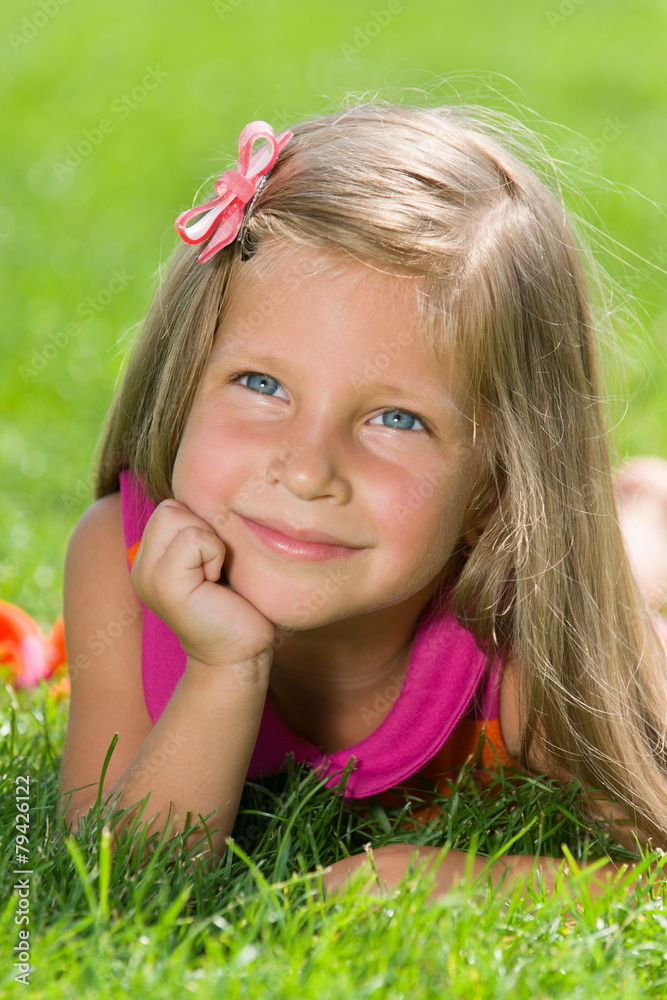 Little girl is on the green grass Little girl is on the green grass