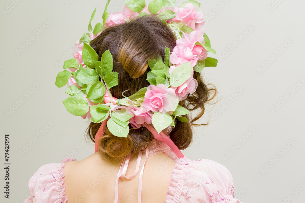 Naklejka premium Young woman. Image of spring. Back view.
