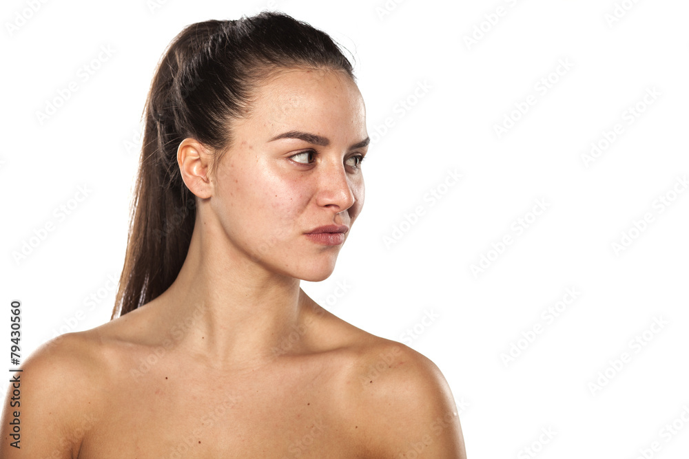 serious young woman without make-up looking to the side serious young woman without make-up looking to the side