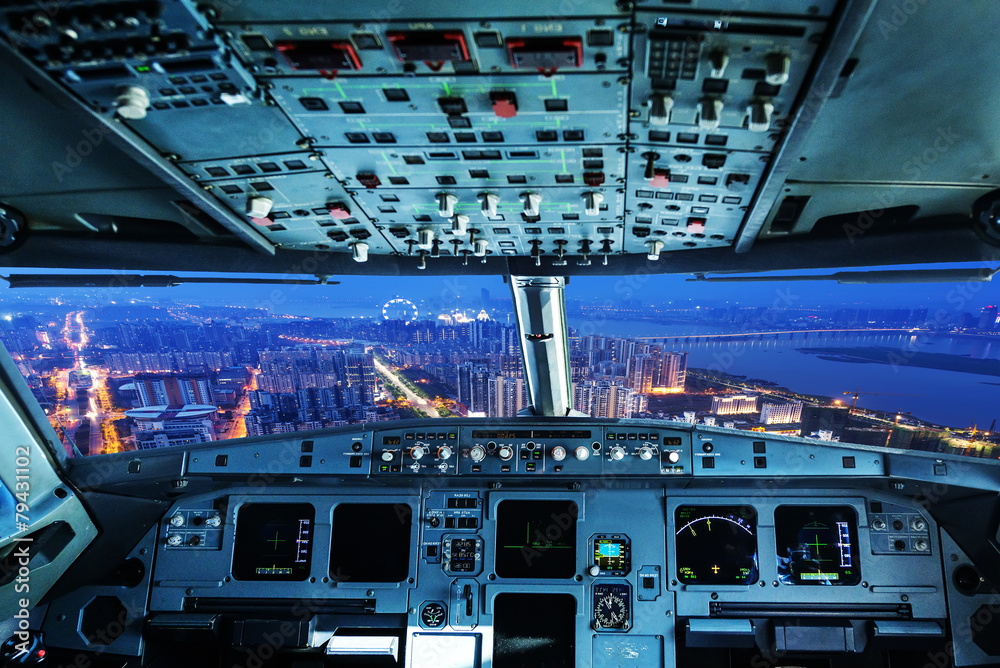 plane cockpit and city of night