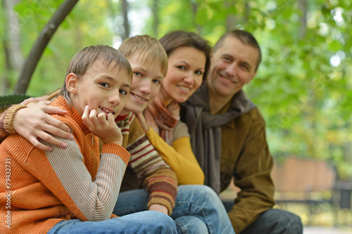 Family of four sitting