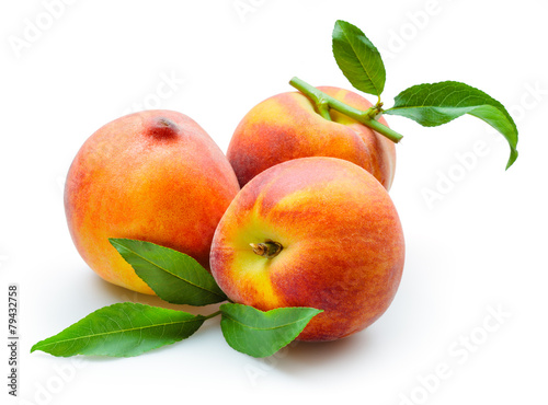 Peach. Fruits with leaves isolated on white