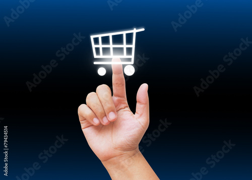 Hand pressing shopping cart buttons with technology background