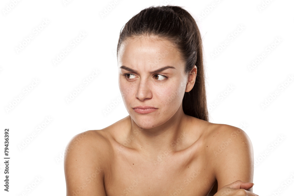 scowling dissatisfied young woman without makeup scowling dissatisfied young woman without makeup