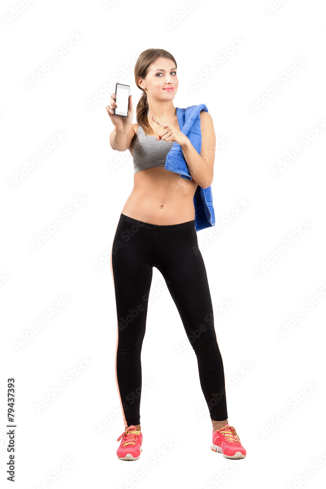 Gym woman presenting blank mobile phone Gym woman presenting blank mobile phone
