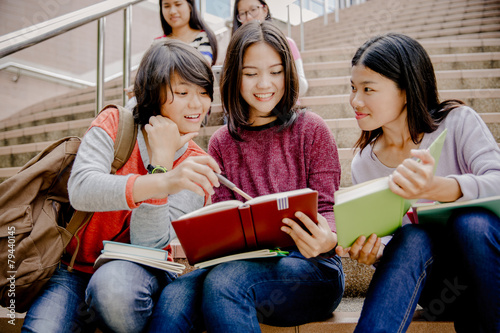 group of happy teen high school students outdoors
