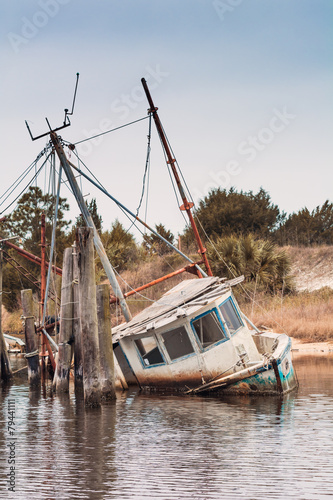 Wrecked shrimping boat half sunken