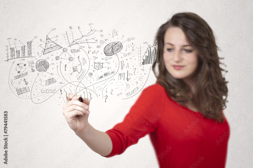 Pretty girl sketching graphs and diagrams on wall Pretty girl sketching graphs and diagrams on wall