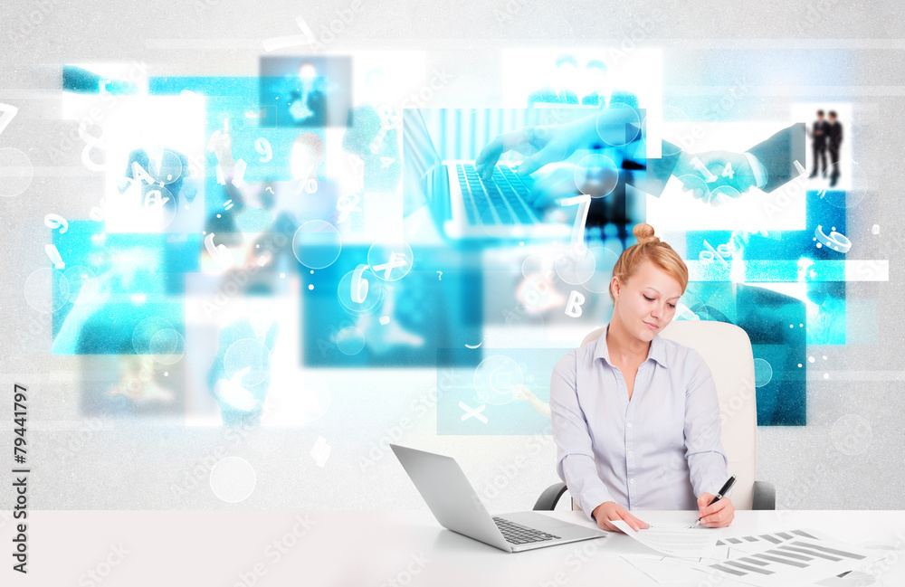 Business person at desk with modern tech images at background Business person at desk with modern tech images at background