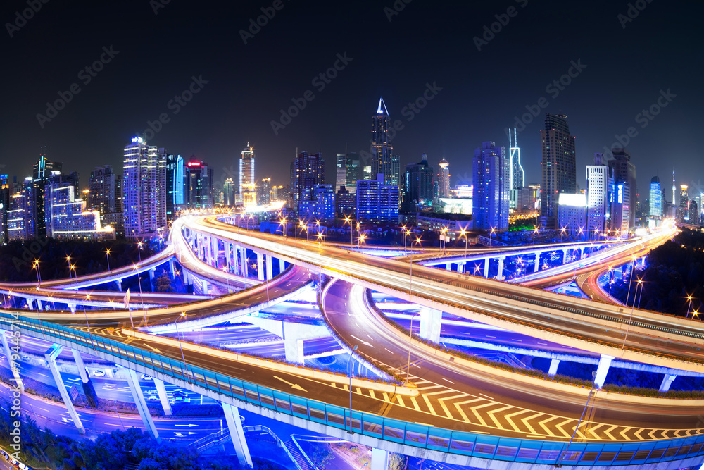 illuminated traffic on elevated expressway in modern city. - obrazy, fototapety, plakaty 