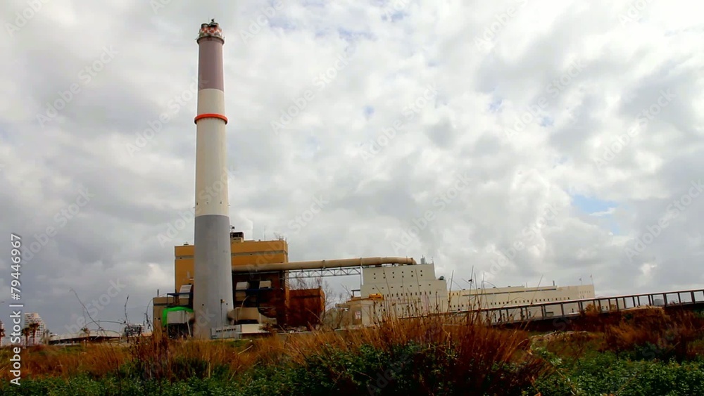 Small power plant on dark cloudy sky background. Small power plant on dark cloudy sky background.