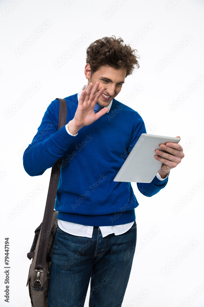happy young man with curly hair using tablet computer happy young man with curly hair using tablet computer