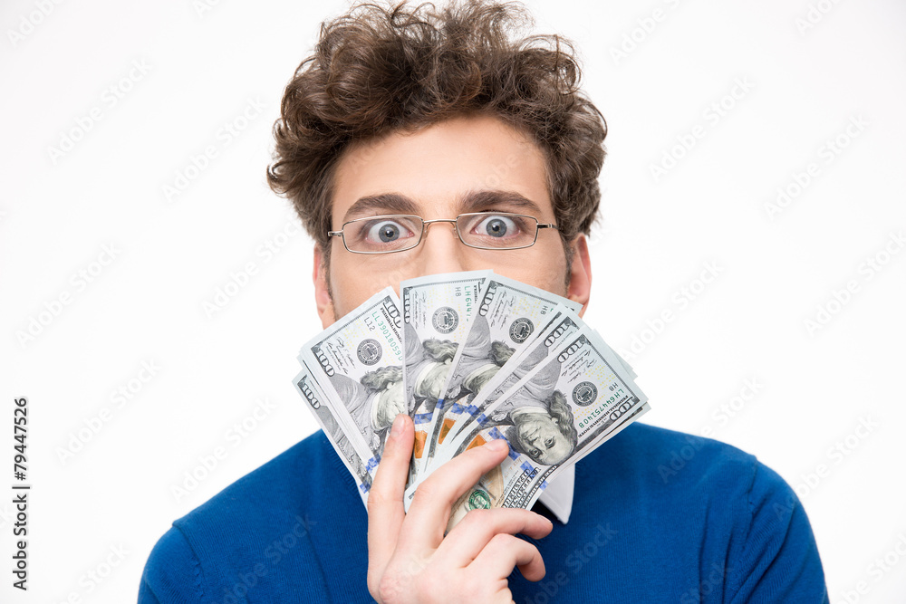Handsome man with money over gray background Handsome man with money over gray background