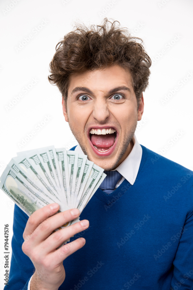 Cheerful businessman holding money over gray background Cheerful businessman holding money over gray background