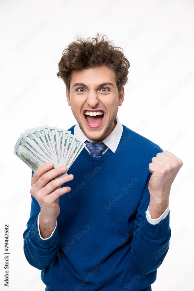 Happy businessman holding money over gray background Happy businessman holding money over gray background