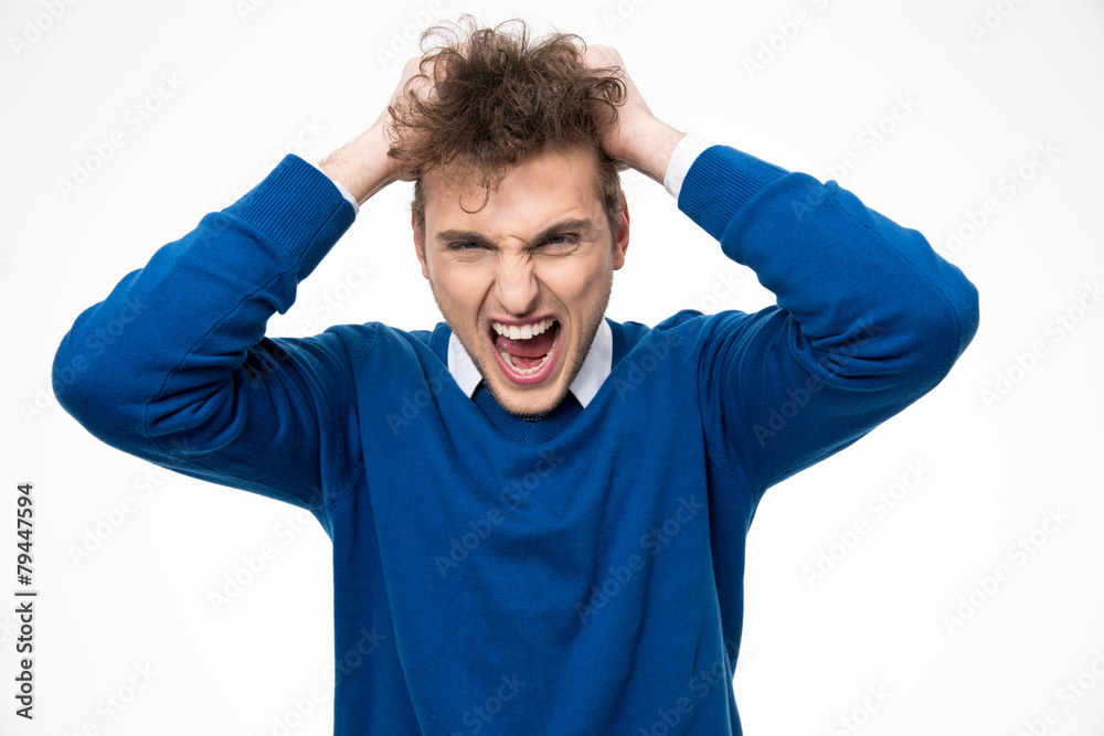 Portrait of angry man shouting and touching his curly hair Portrait of angry man shouting and touching his curly hair