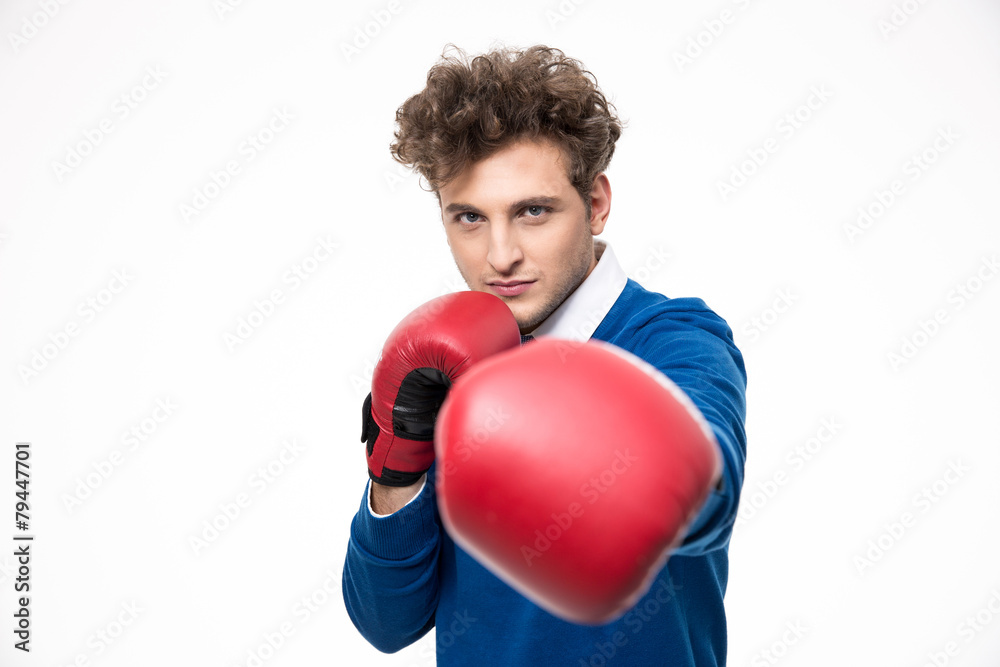 Business man in boxing gloves punching at the camera Business man in boxing gloves punching at the camera