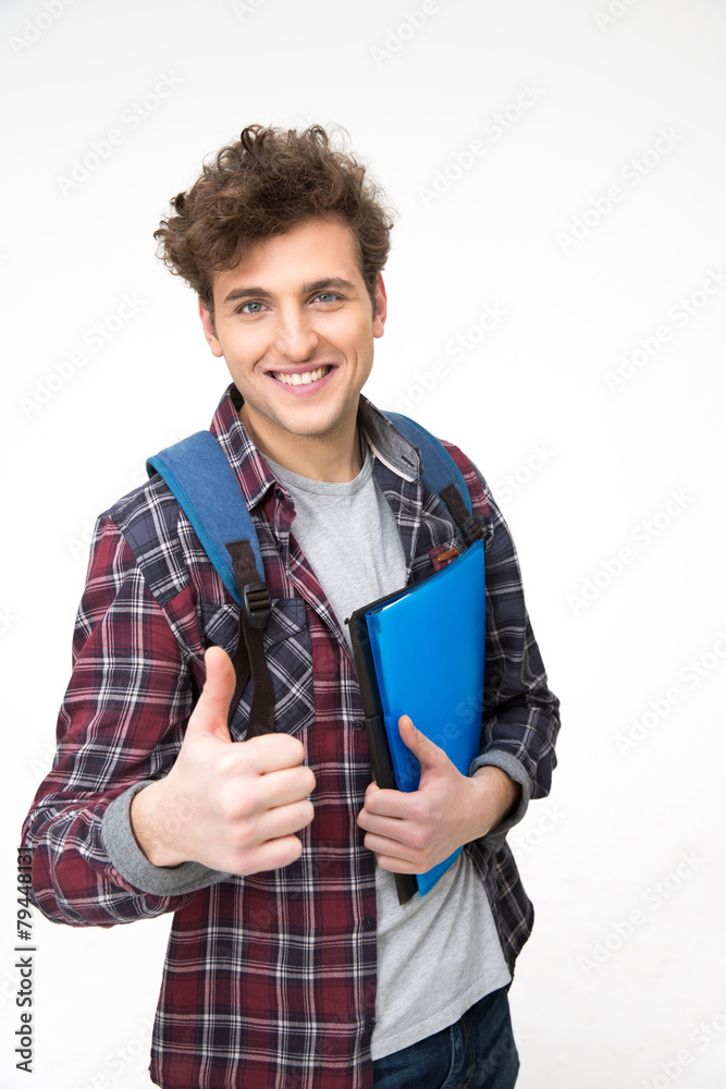 Happy male student with backpack and folders showing thumb up Happy male student with backpack and folders showing thumb up