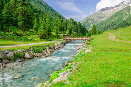 Mountain stream and the high peaks of the Austrian Alps