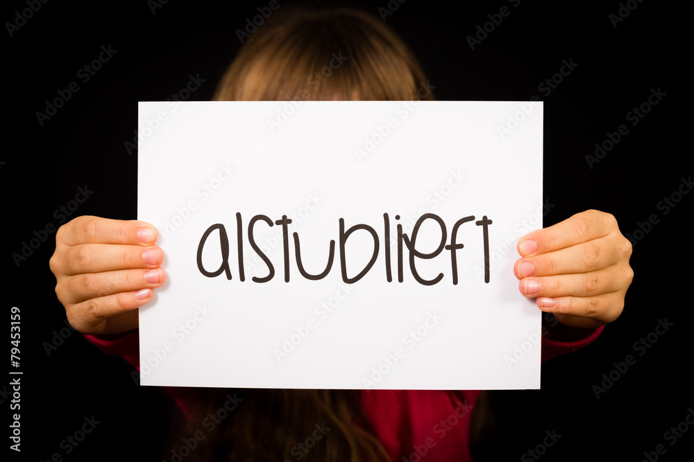 Child holding sign with Dutch word Alstublieft - Please Child holding sign with Dutch word Alstublieft - Please