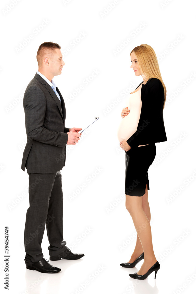 Pregnant businesswoman talking with her partner