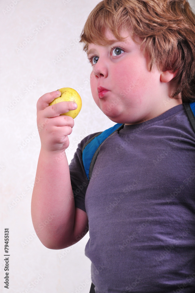portrait of schoolchild eating apple portrait of schoolchild eating apple