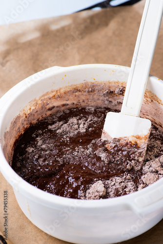 Bowl of chocolate batter being stirred around