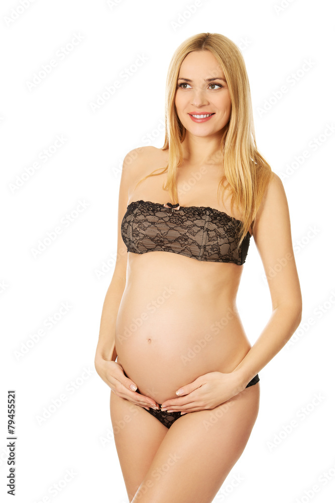 Smiling pregnant woman in lingerie Smiling pregnant woman in lingerie