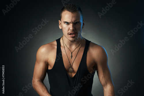 Vászonkép angry man on black background