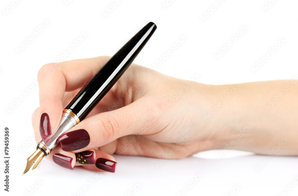 Fountain pen in female hand isolated on white Fountain pen in female hand isolated on white
