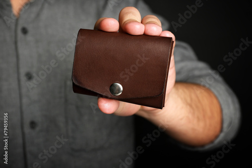 Man holding hand made leath...