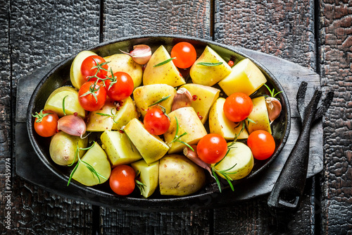 Vegetables with fresh tomato and garlic on barbecue dish