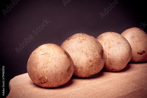 Mushroom brown Champignon on cooking board
