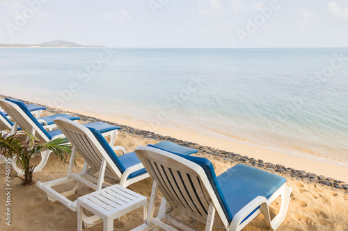 Beach chairs at the empty Maenam Beach in Koh Samui  Thailand