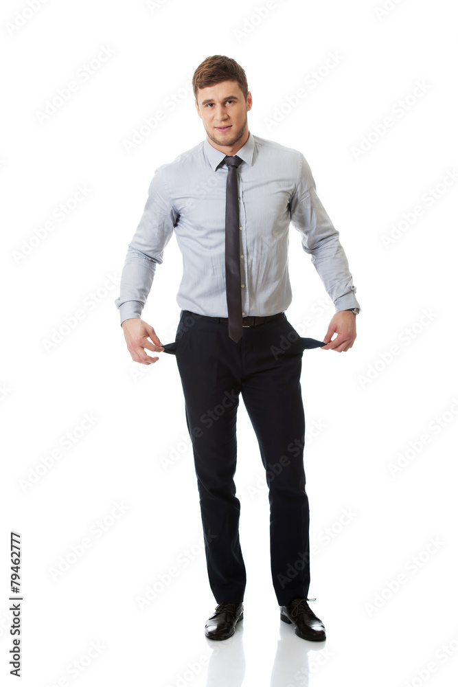 Businessman showing his empty pockets. Businessman showing his empty pockets.