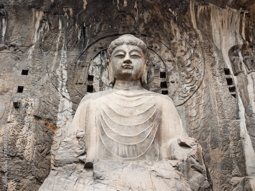 Sitting Buddha statue in Longmen Grottoes