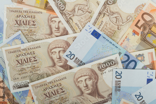 Old Greek 1000 drachmas banknotes and euro bills. photo
