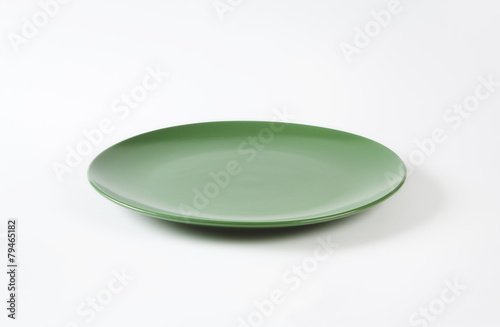 Round solid green dinner plate