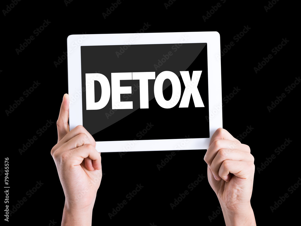 Tablet pc with text Detox isolated on black background Tablet pc with text Detox isolated on black background