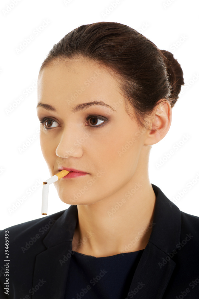 Businesswoman with broke cigarette in mouth. Businesswoman with broke cigarette in mouth.