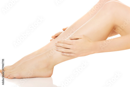 Woman massaging her leg
